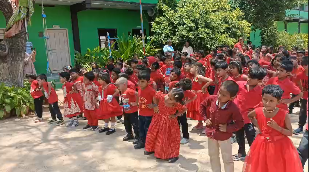 Children performing dance on stage with soft spotlight and rhythm lines