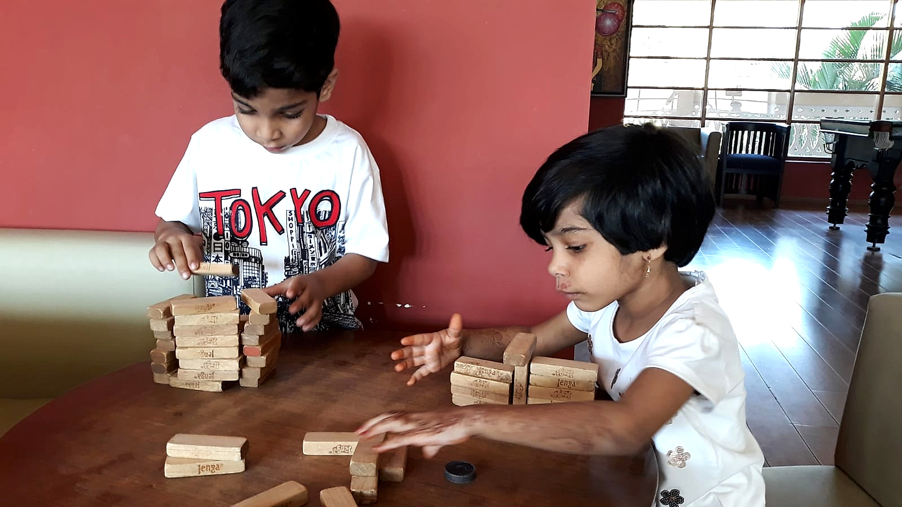 Modern smart classroom with children learning through books, tablets, and creative projects